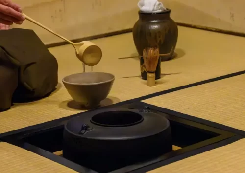 Discover Kanazawa’s Culture: 7 Unique Local Interactions You Can’t Miss "A person preparing matcha tea during a traditional Japanese tea ceremony."