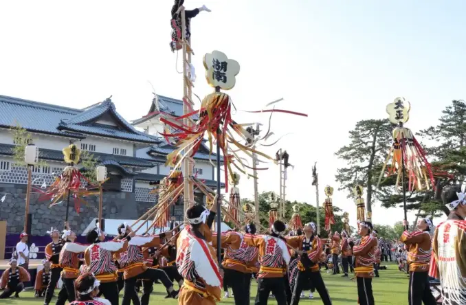 "A vibrant Japanese festival with people in colorful yukata, food stalls, and traditional music."