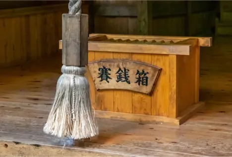 Shinto Shrines vs. Buddhist Temples in Japan: 5 Shocking Differences of Rituals, and How They Operate "A wooden saisenbako (offering box) at a Japanese shrine, where visitors make offerings of coins as part of their prayers and rituals."