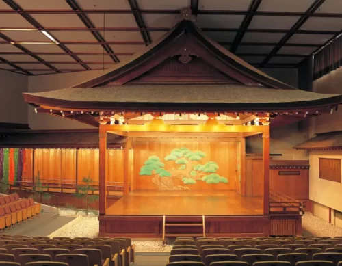 "Inside view of Kanazawa Theater with stage and audience seating"