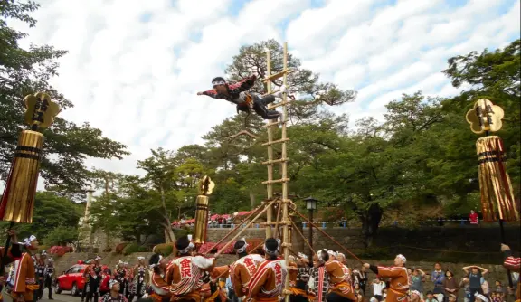 Kaga-tobi firefighters performing traditional ladder stunts at Kanazawa Castle park