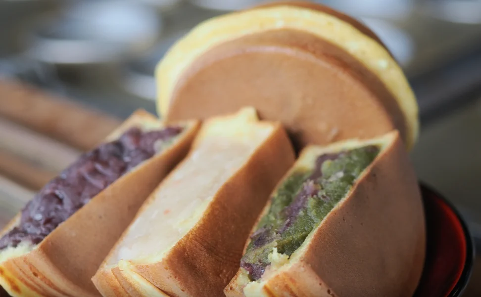 Japanese dorayaki pancakes filled with sweet red bean paste, white bean paste, and matcha-flavored filling.