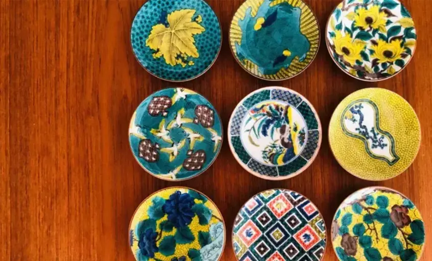 Traveler discovering handmade crafts and local sweets in Kaga’s hot spring towns