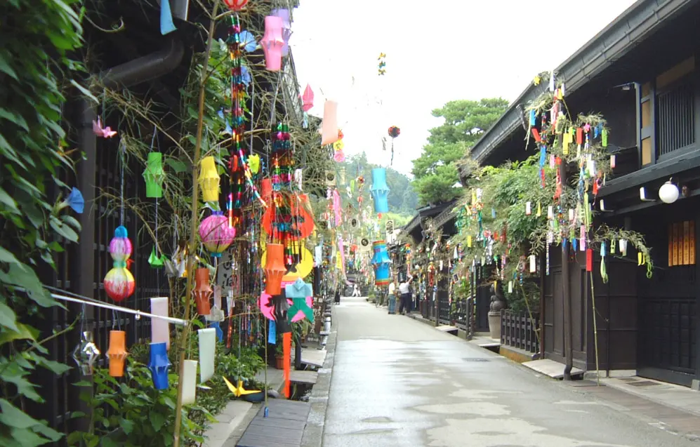 Takayama’s Sanmachi Suji decorated with colorful Tanabata streamers and traditional festival ornaments.