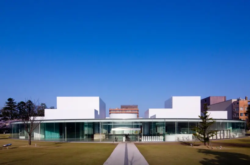 The modern white exterior of the 21st Century Museum of Contemporary Art in Kanazawa, symbolizing harmony of old and new.