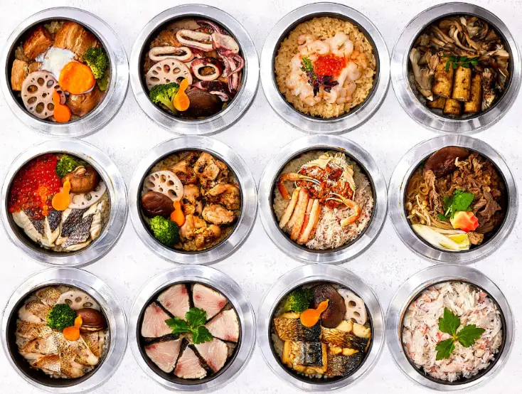 A display of colorful Kutani ware plates and bowls inside the Kutani Mangetsu shop in Kaga, Ishikawa.